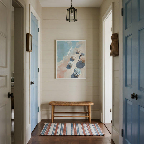 Minimalist beach umbrella print with loungers on a pale sandy shore.