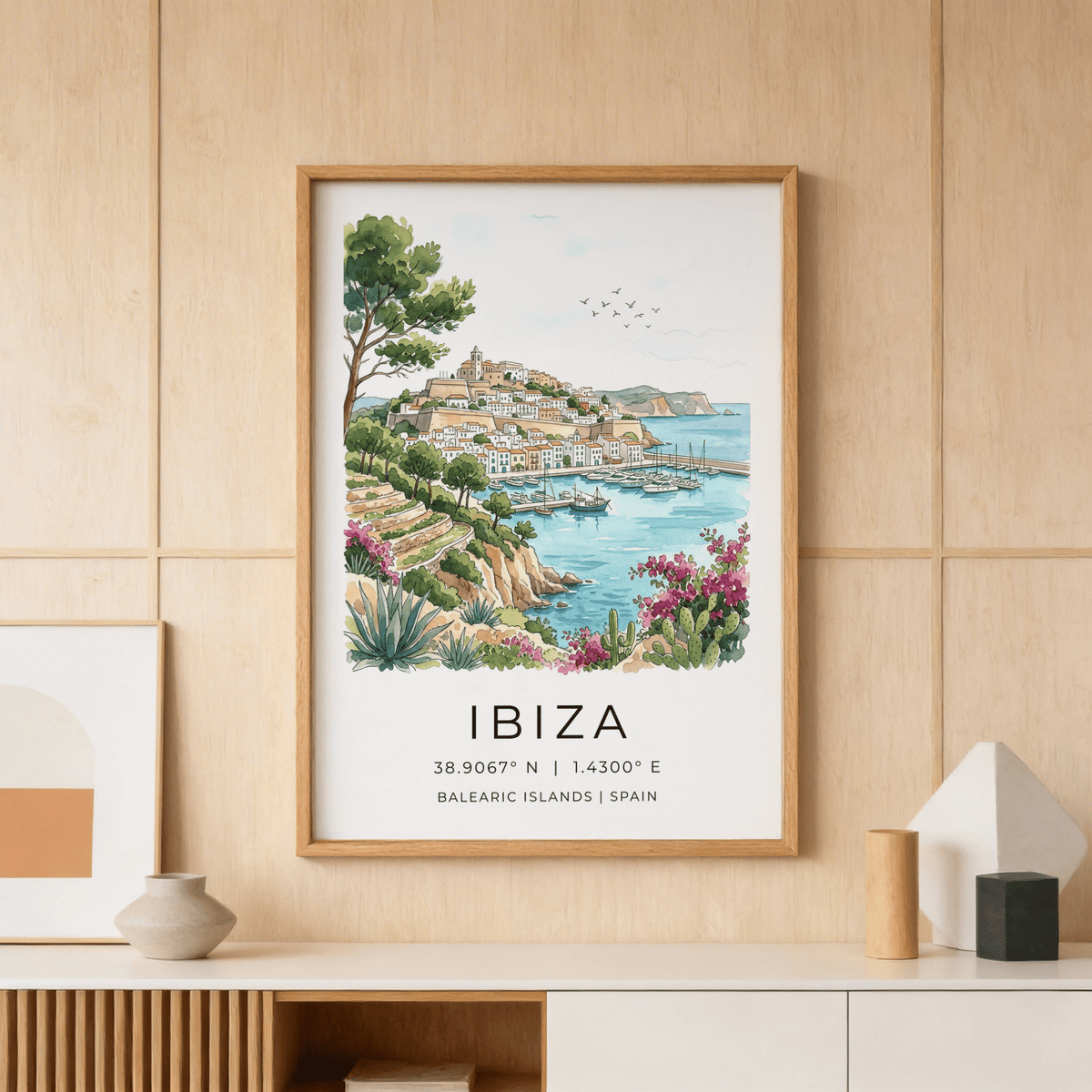 Illustrated harbor wall art showing hillside buildings, sailboats, and cactus plants