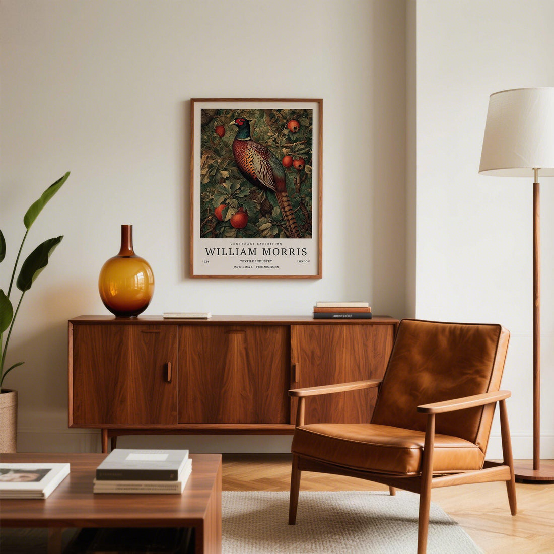 Vintage-style pheasant print in a wooden frame above a walnut sideboard with an amber vase and a leather armchair