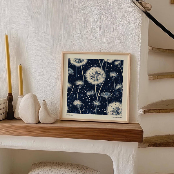 Soft white dandelions featured in calming navy and white wall art