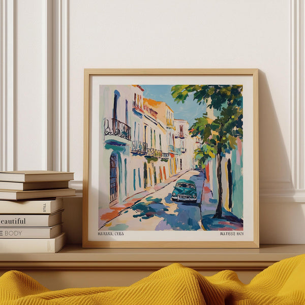 Paintings of Cuba featuring a classic Havana car on a sunlit street.