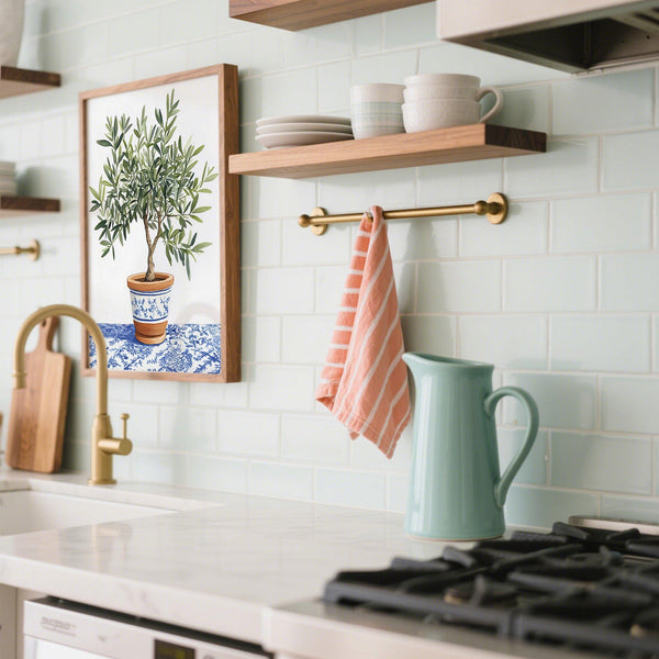 Kitchen wall Olive Tree Art with delicate green foliage and rustic pottery.