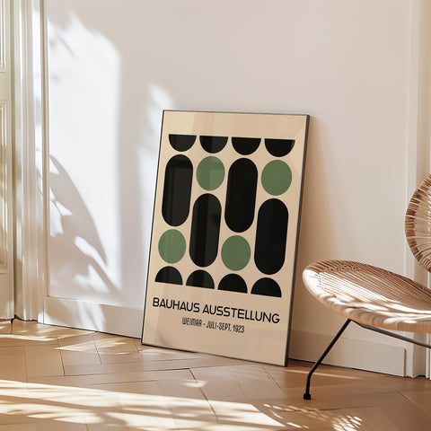 Green and black Bauhaus poster in a living room