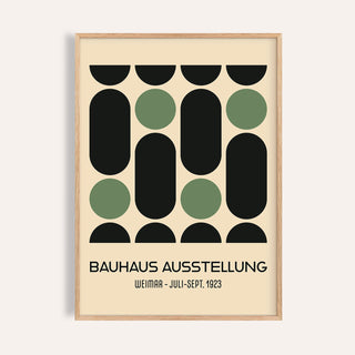 Wall Art for Office close-up of abstract geometric shapes in black and green with text in a light wood frame