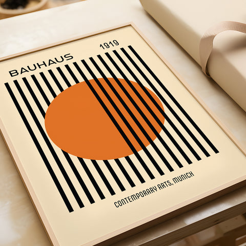 Striking orange and black Bauhaus "Striped Sun" poster design
