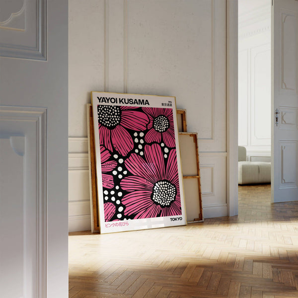 Striking pink posters featuring high-contrast dot patterns