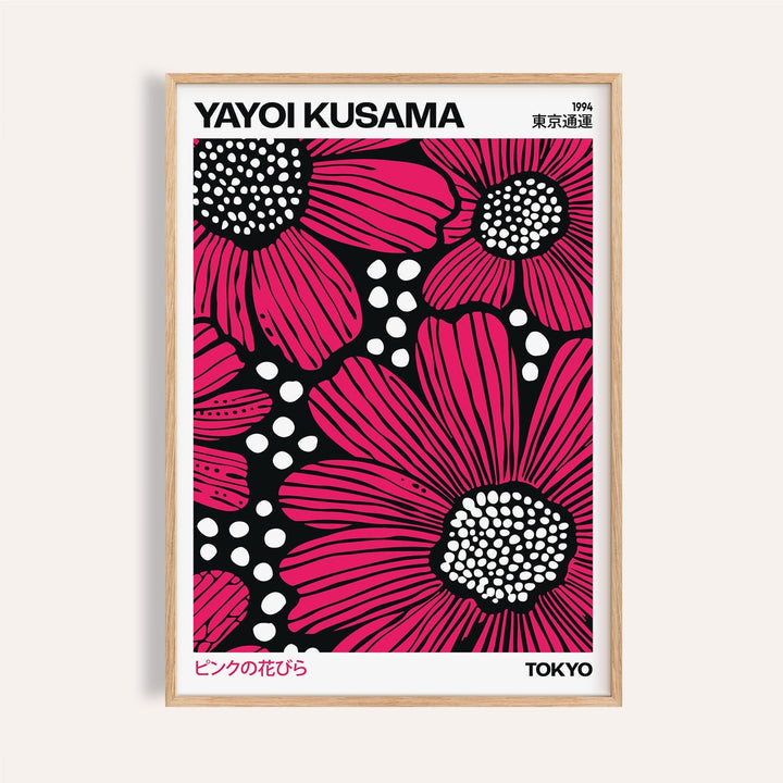 Pink posters with bold floral designs in black and white contrast