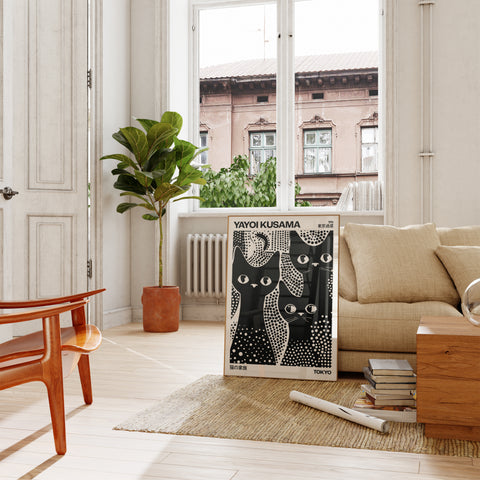 Black and white poster of three cats with Kusama-inspired design