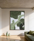 Modern living room with abstract green artwork on the wall and a green sofa.