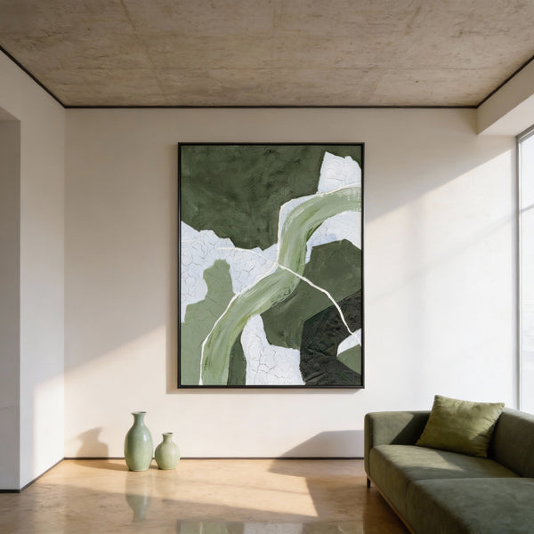 Modern living room with abstract green artwork on the wall and a green sofa.