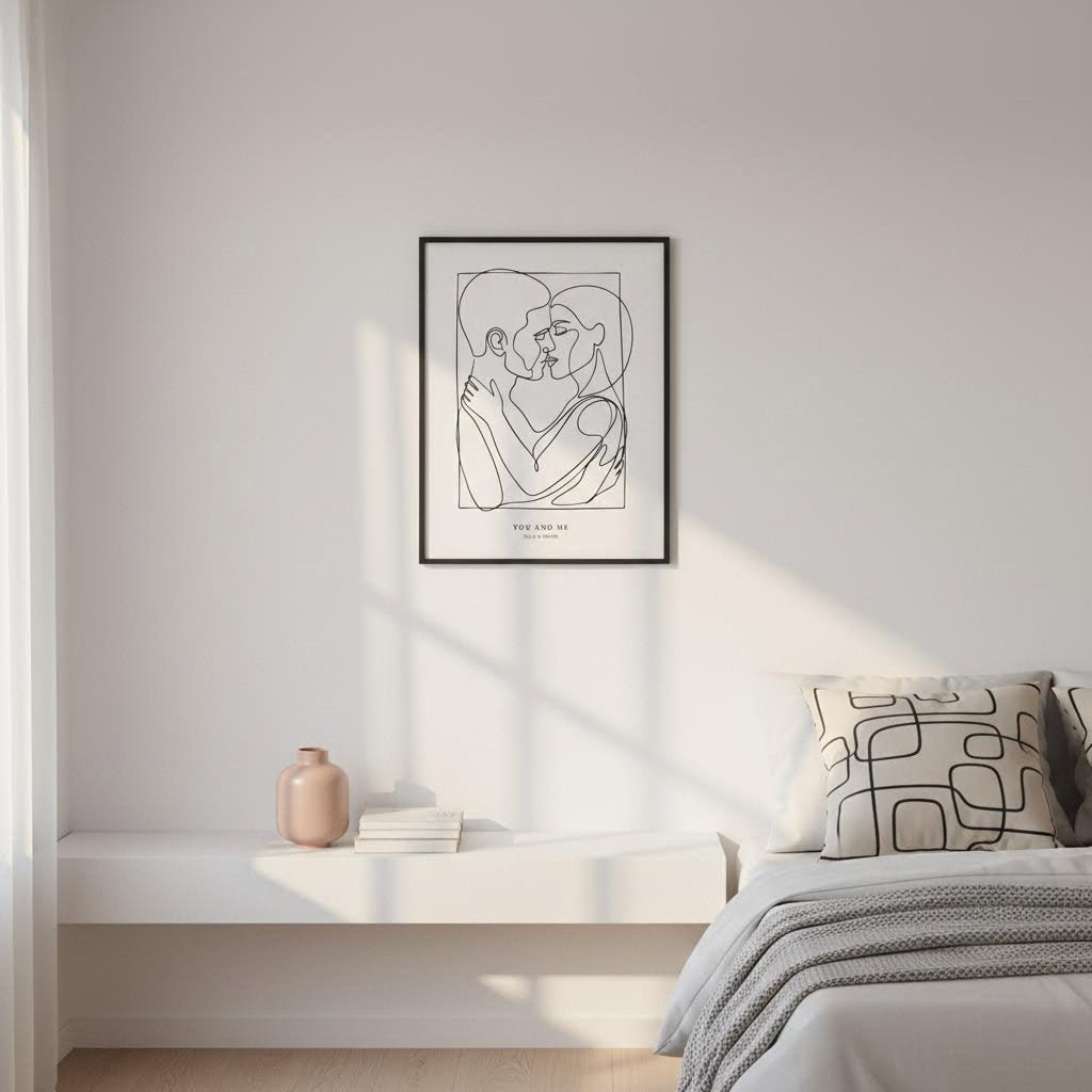 Framed abstract art print on a wall above a bed with neutral decor.