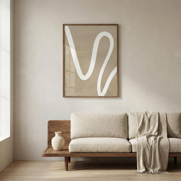 Beige sofa with a wooden frame in a room with a abstract wall art