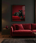 Red sofa in a living room with a print of a panther on the wall.