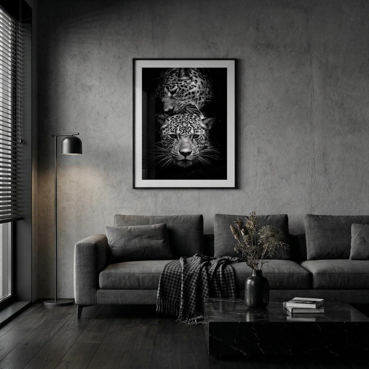 Living room with a gray sofa, coffee table, and wall art of a leopard's face.