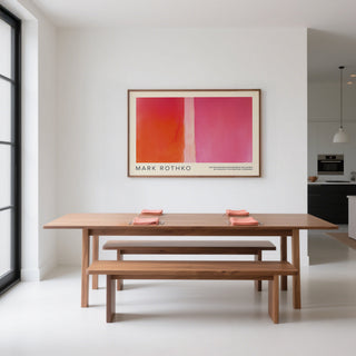 Dining room with wooden table and benches, Mark Rothko painting on wall