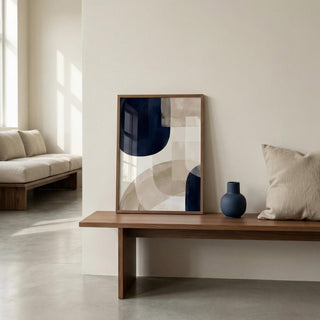 Modern living room with abstract art and a vase on a wooden table.