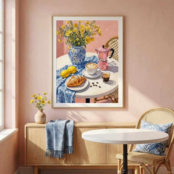 Framed artwork of a table setting with flowers and coffee on a pink wall.