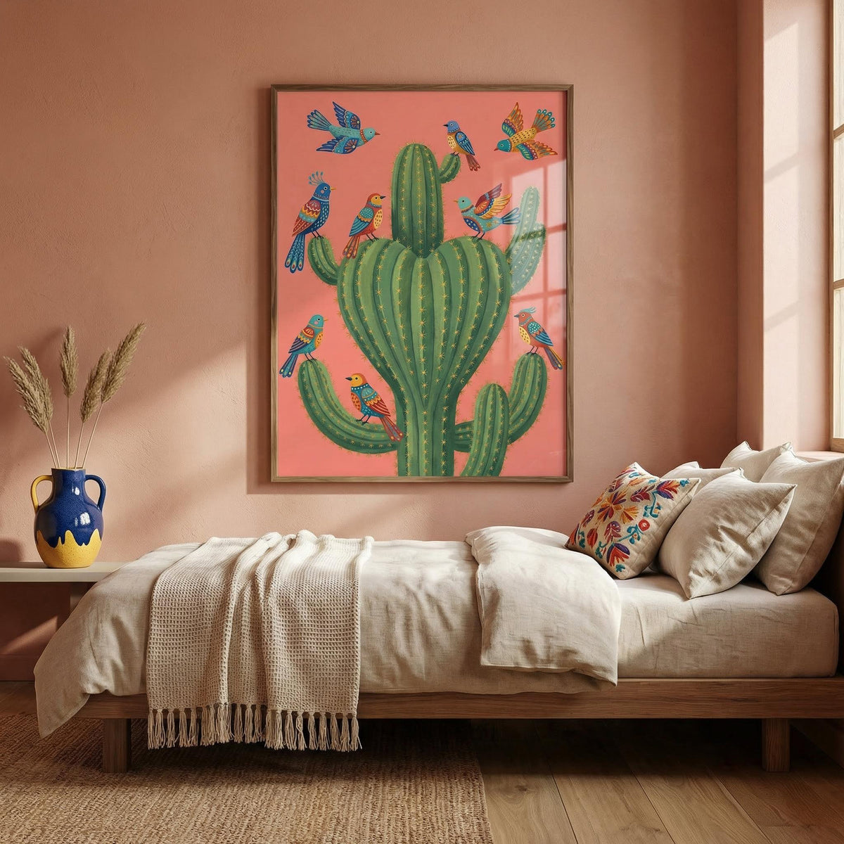 Bedroom with a colorful cactus and bird painting on a pink wall.