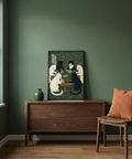 Room interior with a painting of cats on a wall, wooden cabinet, and chair.