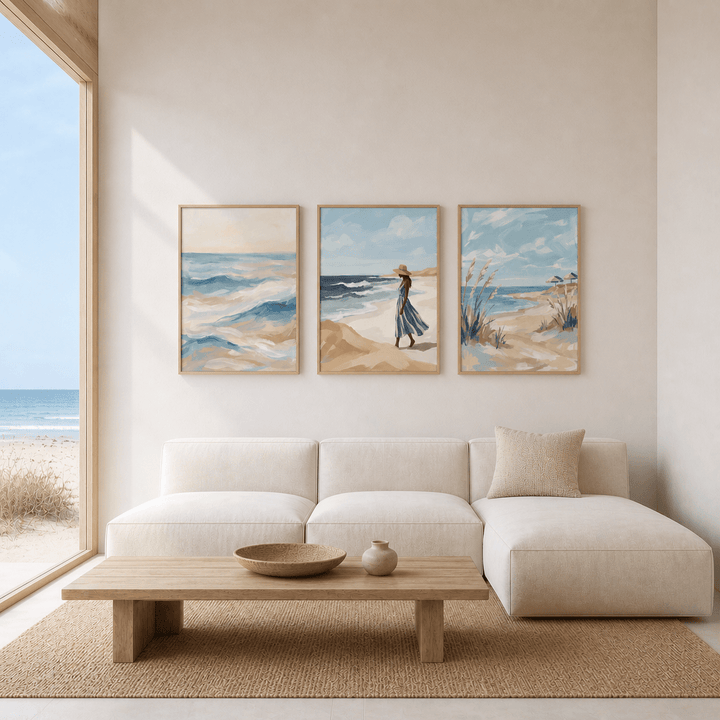 Modern living room with a white sofa, wooden coffee table, and beach-themed wall art.