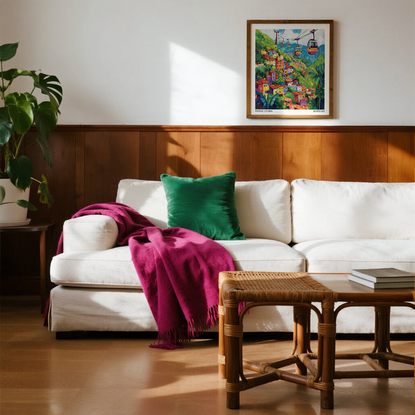 Living room with a white sofa, Colombia wall art, and wooden coffee table.
