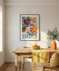 Dining room with a wooden table, chairs, and a colorful framed artwork on the wall.