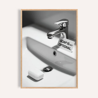 Modern wash hands sign with chrome faucet and bold soap reminder.