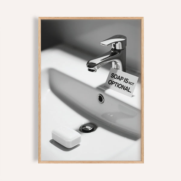 Modern wash hands sign with chrome faucet and bold soap reminder.