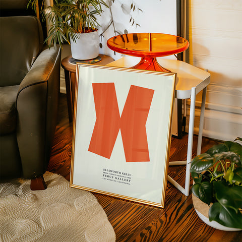 Geometric wall art featuring an orange shape on cream background
