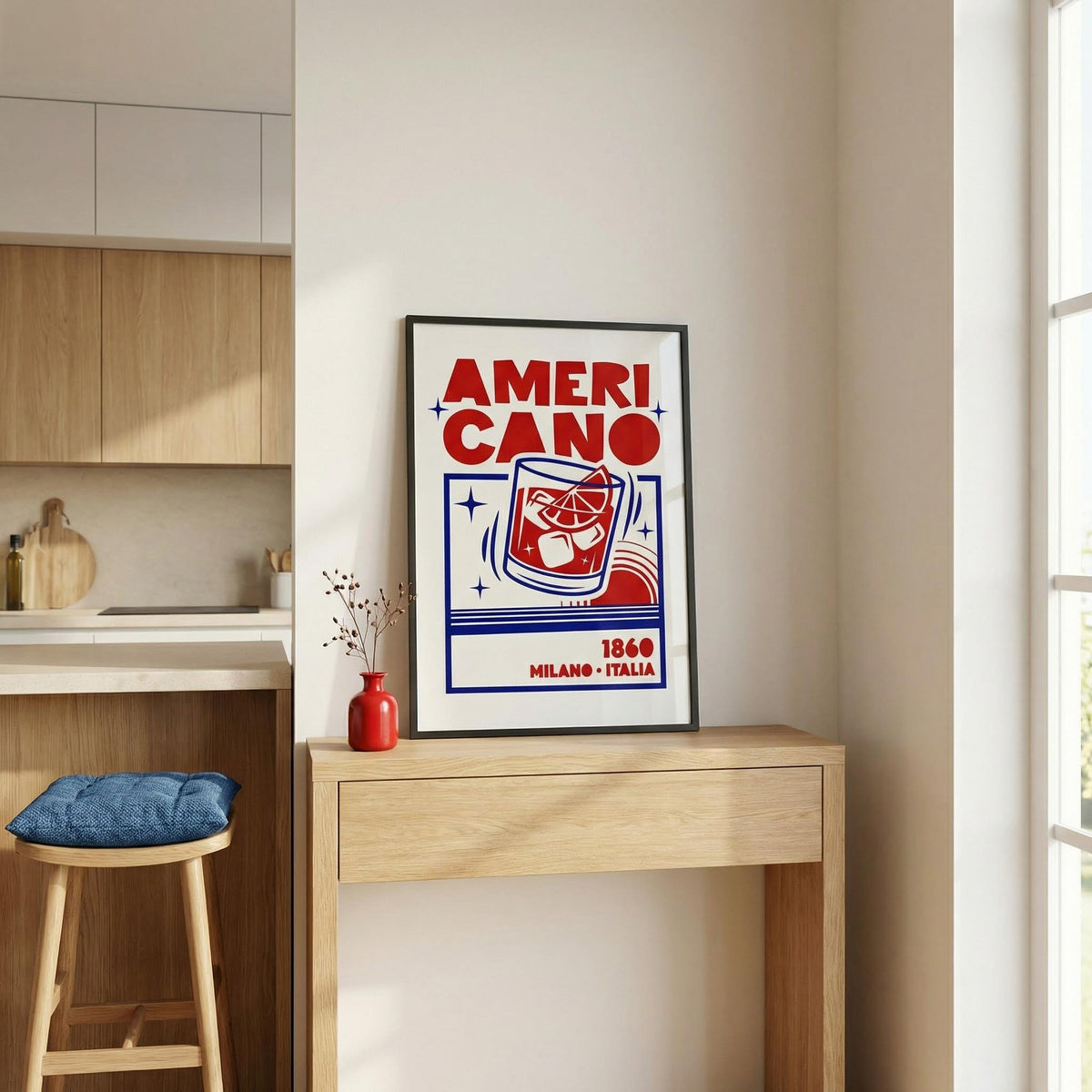 Framed 'AmeriCano' cocktail poster on a wall in a kitchen setting