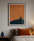 Framed artwork above a bed with orange accents