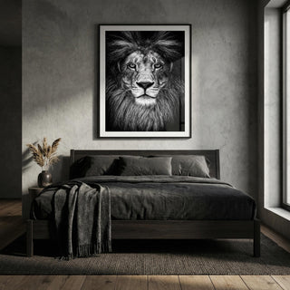 Framed artwork of a lion's face above a bed in a bedroom setting.