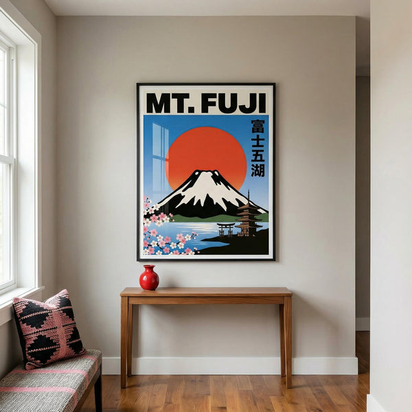 Framed poster of Mount Fuji in a room with a wooden table and cushioned bench.