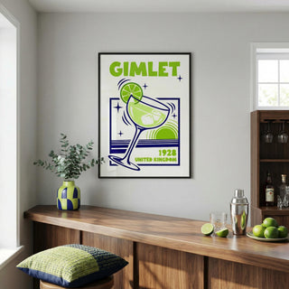 Framed poster of a gimlet with lime garnish in a room with a bar setup.