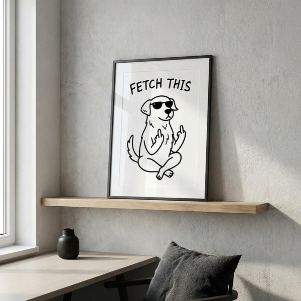 Framed artwork of a dog with sunglasses and 'FETCH THIS' text on a wall above a desk.