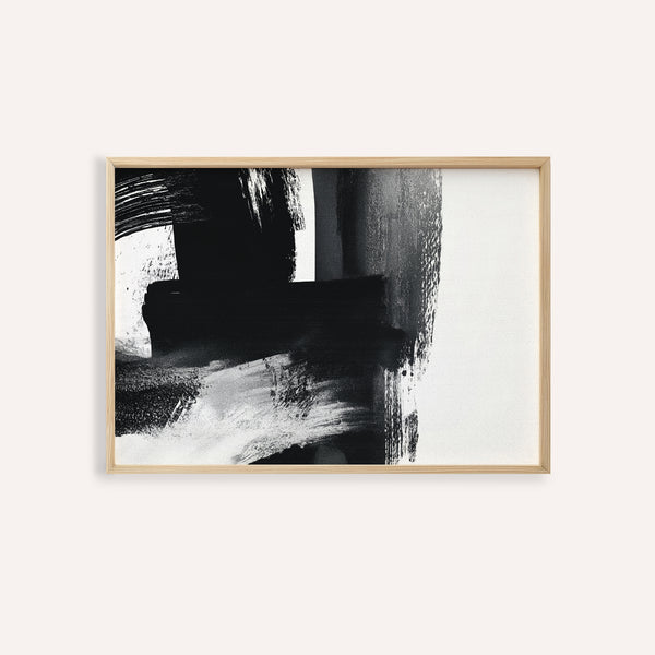 Minimalist Black and White Print in a wooden frame on a white wall