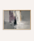 Abstract art piece with a gold frame on a white wall