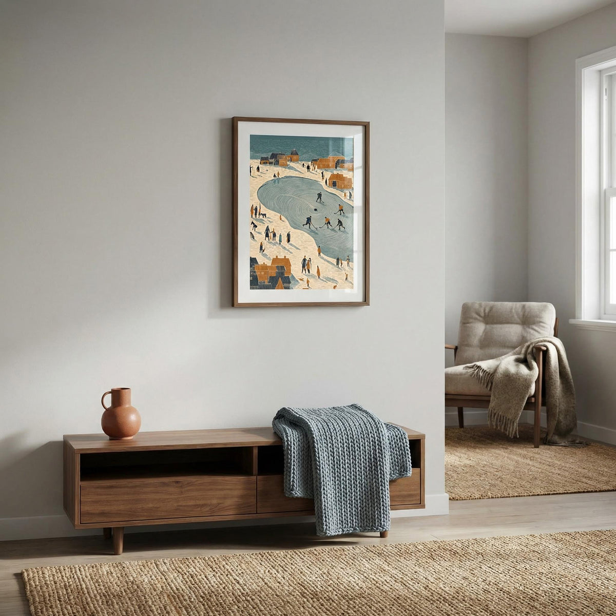 Living room with wooden cabinet, vase, and framed artwork on a wall.