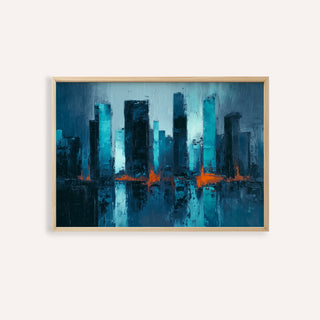 Close-up of blue artwork city with abstract skyline and orange reflections in light wooden frame