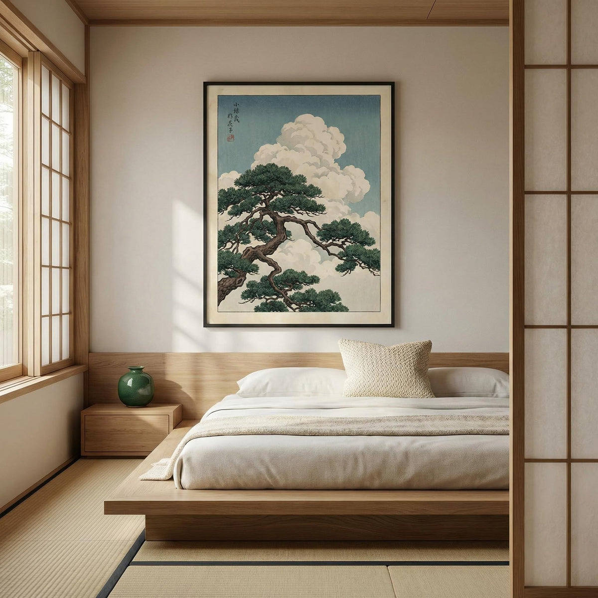 Japanese-style bedroom with a large framed artwork of a tree and clouds on the wall.