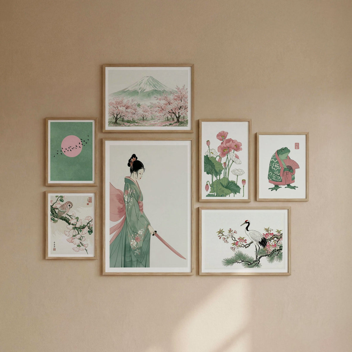 Japanese wall art set of seven in green and pink tones displayed on a wall.

