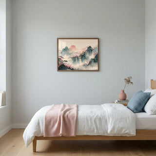 Bedroom with a bed, pink blanket, and framed artwork on the wall.
