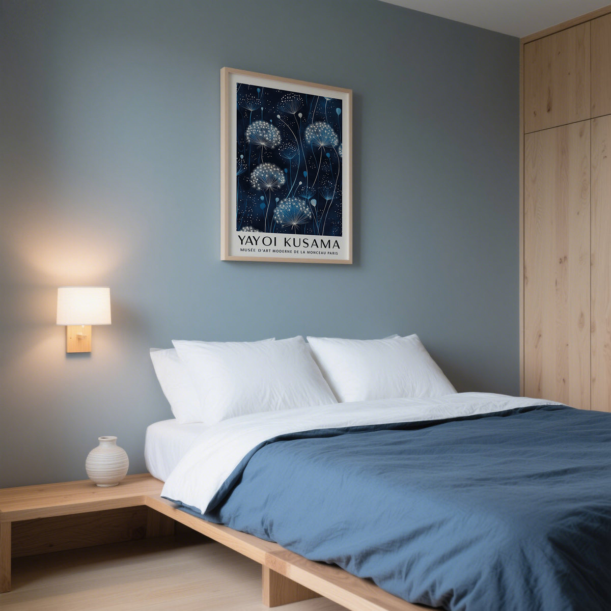 Minimalist bedroom decor using Kusama-style blue and white wall art