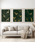 Living room with a beige sofa, decorative pillows, and three framed artworks of birds on a green background.