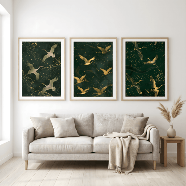 Living room with a beige sofa, decorative pillows, and three framed artworks of birds on a green background.