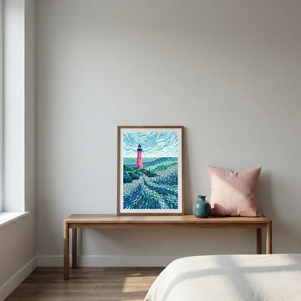 Framed artwork on a wooden bench with a pink pillow against a plain wall.