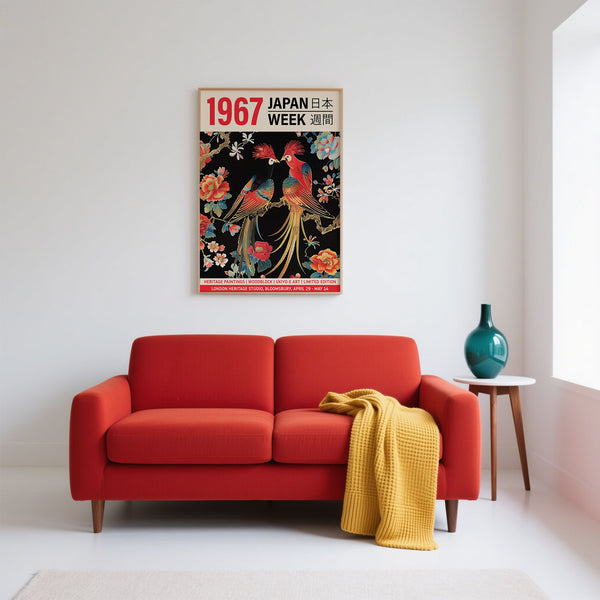 Red sofa with a yellow blanket in a room with a decorative poster on the wall.
