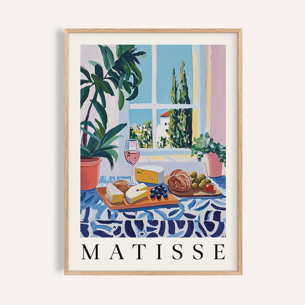 French prints artwork with bread, cheese, and rosé on a blue patterned table

