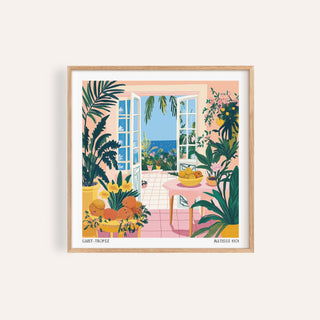 Framed Coastal wall art of open doors showing sea view with plants and fruit bowl