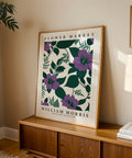 Vintage floral wall art with purple flowers and green leaves
